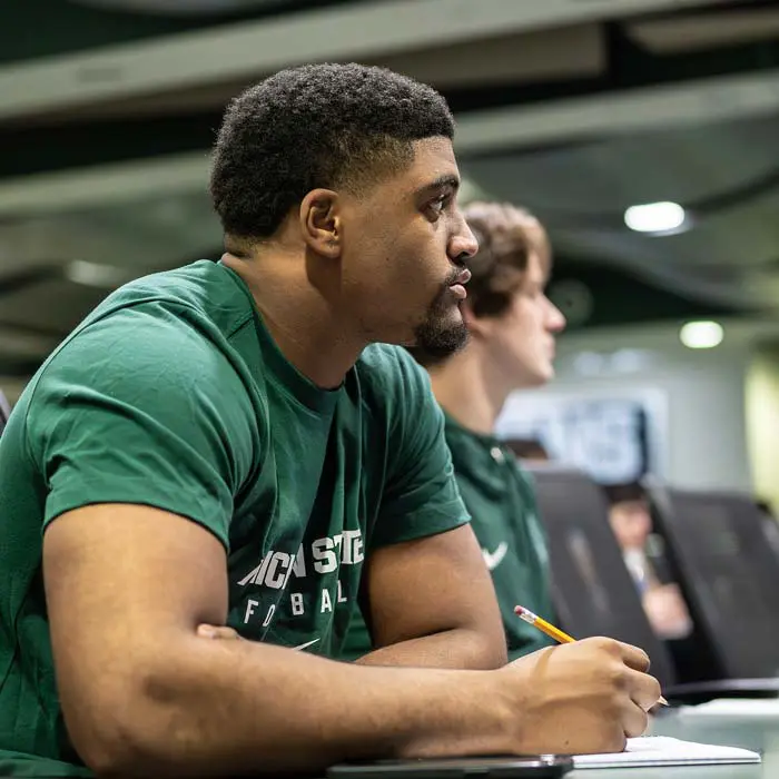 student-athlete in class