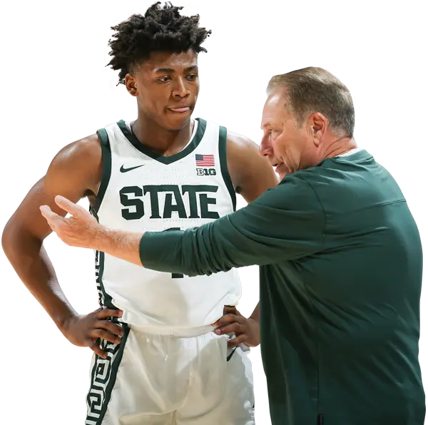 Coach talking to basketball player