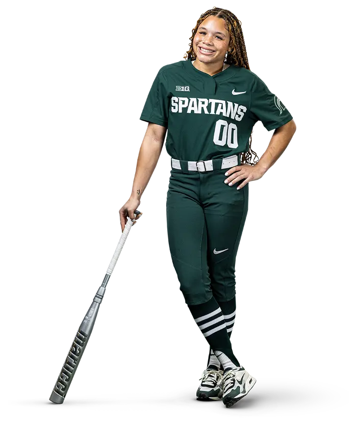 softball player posing with bat