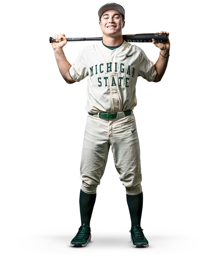 baseball player posing with bat