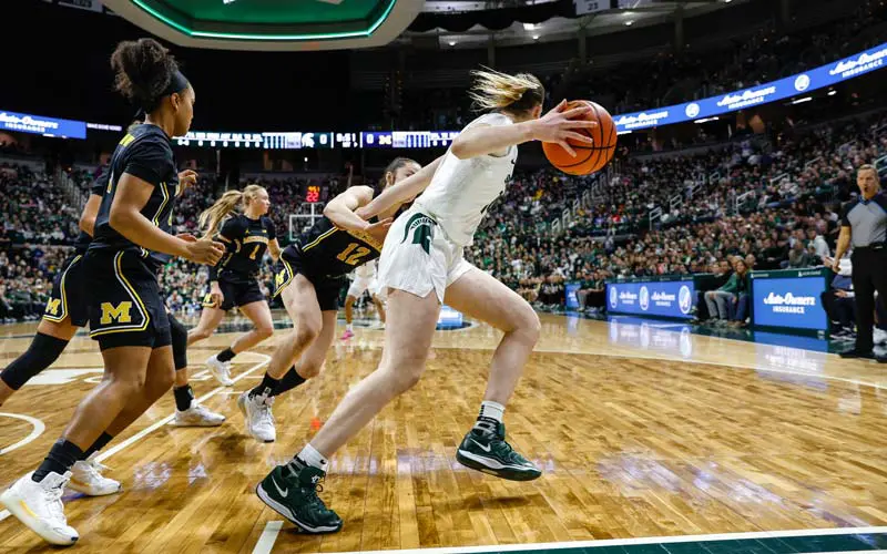 Women playing basketball